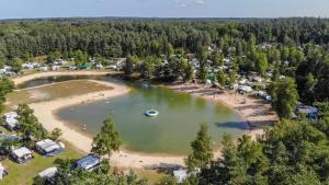 an aerial view of a lake with a boat in it at Siblu de Tol in Nunspeet