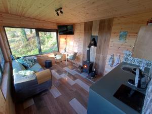 an overhead view of a living room of a cabin at The Nest - Secluded Cabin with Panoramic Views in Gurteenulla +9 photos