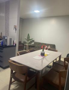 a dining room with a table and some chairs at Tecnoshow in Rio Verde +3 photos