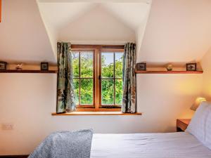 a bedroom with a bed and a window at 2 Bed in Craven Arms oc-95107 in Kerry