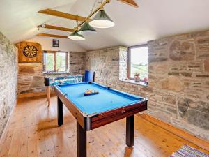 a pool table in a room with a stone wall at 2 Bed in Craven Arms oc-95107 in Kerry