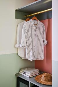 a shirt hanging on a rack in a closet at Wayfinder Newport in Newport