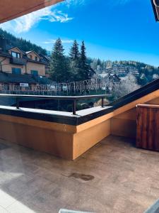a balcony with a view of a mountain at Piazzetta Montecampione in Pian Camuno