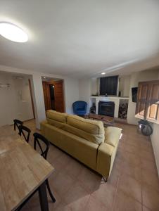a living room with a couch and a table at Casa Gabriela in Palomera