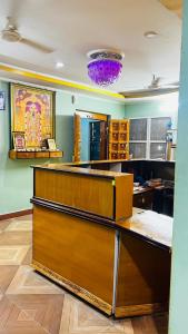 a large room with a counter top in a room at Sri Seshadri Rest House in Avanigadda +19 photos