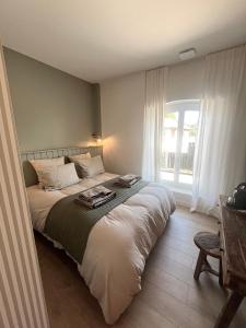 a bedroom with a bed and a window at Le Clos des Berges de l'Ain in Charnoz +64 photos
