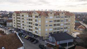 a large building with birds on top of it at Apartman Panorama 2 in Požarevac