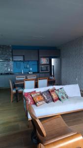 a bedroom with a bed with pillows on it at Hotel Mirage in Vilhena +40 photos