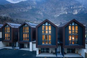 a group of homes with mountains in the background at Valdastico Short Rentals in Maso