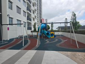 a playground in front of a apartment building at Aliffheight in Johor Bahru
