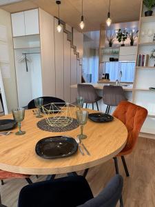 a dining room with a wooden table and chairs at Weekend apartment 3 in Sigulda