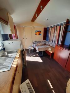 a kitchen with a sink and a table in it at CCA area in Hio