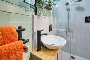 a bathroom with a sink and a shower at Host & Stay - Curlews Rest in Longridge