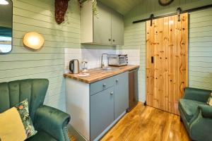 a kitchen with two chairs and a sink in a room at Host & Stay - Curlews Rest in Longridge +15 photos