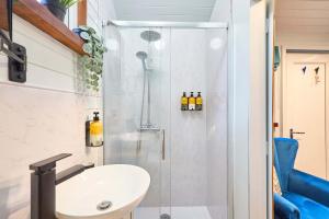 a bathroom with a shower and a sink at Host & Stay - Swallows Nest in Longridge