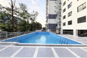 a swimming pool in the middle of a building at Araka Homes-Westlands in Nairobi