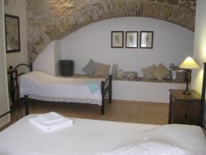 Ein Bett oder Betten in einem Zimmer der Unterkunft Nel cuore di Spello