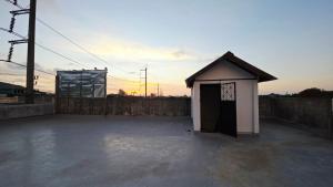 a basketball court with a hoop and a basketball hoop at SUP Hometel Phuket in Ban Thalat Choeng Thale