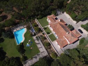 an aerial view of a house with a swimming pool at Villa Malveira in Alcabideche