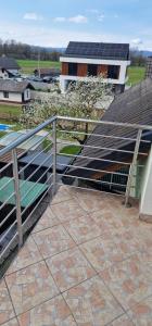 a stairway with solar panels on a roof at Apartman MURKO S-3 in Ig