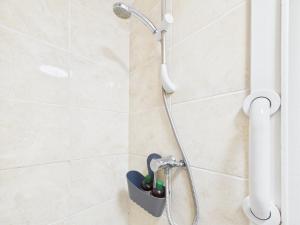 a shower with a shower head in a bathroom at Parkview Guest House in King's Lynn +67 photos