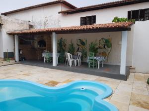 a house with a painting on the side of it at Casa Dos Vovôs Pousada em Canoa Quebrada in Aracati