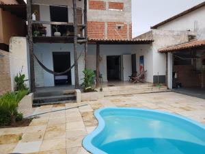 a swimming pool in the yard of a house at Casa Dos Vovôs Pousada em Canoa Quebrada in Aracati +6 photos
