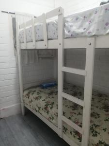 a couple of bunk beds in a room at Punta hermosa casa playa in Punta Hermosa