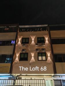 a building with a sign that reads the lot at The Loft hotel 68 in Butterworth
