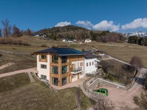 an aerial view of a house in a field at Nest Family, Bedollo Ospitar in Bedollo