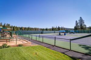 a tennis court with two tennis courts at Tranquil cabin near ski slopes & trails with wraparound deck & pool table in Truckee
