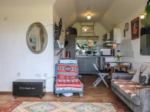 a living room with a couch and a table at The Old Telephone Exchange in Exeter +23 photos
