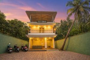 two motorcycles parked in front of a building at Marshmallow - by MA Homes in Morjim