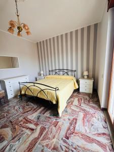 a bedroom with a bed and a large rug at MR1 House Gallipoli in Gallipoli