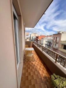 a balcony with a table and chairs on a building at MR1 House Gallipoli in Gallipoli