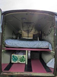 a bed in the back of a van at Bus magique avec tente glamping in Saint-Palais