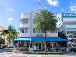 a building with a palm tree in front of it at The Marlin Hotel in Miami Beach