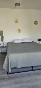a bedroom with a bed with two mirrors on the wall at La parenthèse Provençale-Maison à Grillon avec wifi in Grillon +57 photos