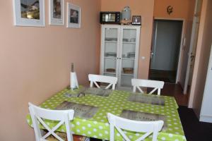 a dining room with a table and chairs at Fereinwohnung an der Ostsee E312 in Schönberg