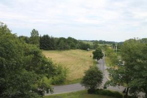 an aerial view of a road with trees and a field at Fereinwohnung an der Ostsee E312 in Schönberg +2 photos