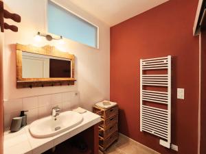 a bathroom with a sink and a mirror at La Source Du Bonheur Chambres et Table d'Hôtes in Rieupeyroux +71 photos