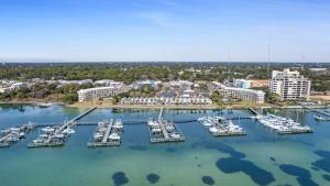 an aerial view of a marina with boats in the water at Pirates Bay B215 in Fort Walton Beach
