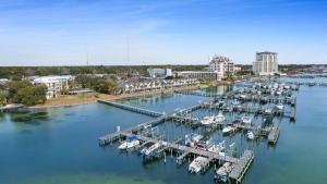 an aerial view of a marina with boats in the water at Pirates Bay B215 in Fort Walton Beach