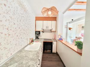 a kitchen with a sink and a counter top at Villabett Caudiel está de moda in Caudiel