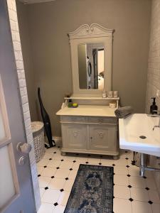 a bathroom with a sink and a mirror at Apartmán No 244 in Tábor +12 photos