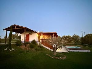 a small house with a pool in a yard at Courela do Monte Novo II in Santa Susana