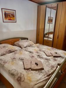 a bedroom with a bed with two towels on it at Ferienwohnung Theisen in Bernkastel-Kues