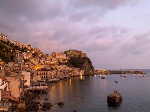 a view of a city with boats in the water at Un Tuffo nello Stretto in Villa San Giovanni