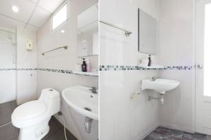 a white bathroom with a toilet and a sink at Dancenter Rq Suvarnabhumi Airport in Bangkok +18 photos