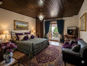 a bedroom with a bed and a couch at Borgo Maggiore in Radicofani